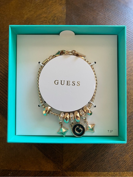 Guess Jewelry - GUESS Gold-Tone Charm Bracelet with Black Accent - 7.5in